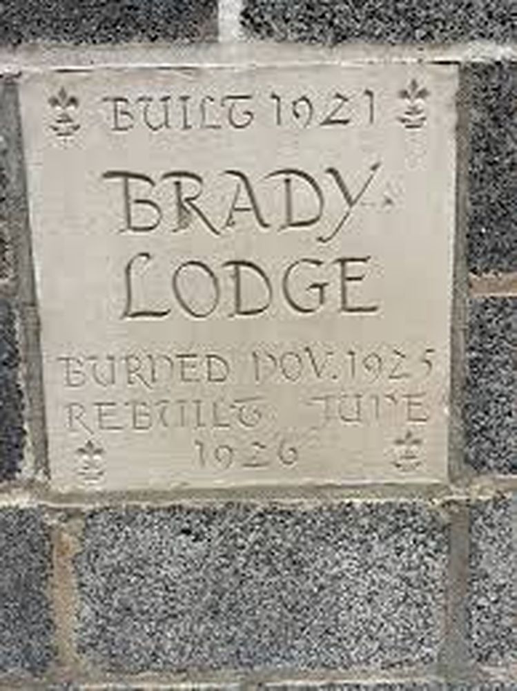Stone plaque reading Built 1921, Brady Lodge, Burned Nov 1925, Rebuilt June 1926